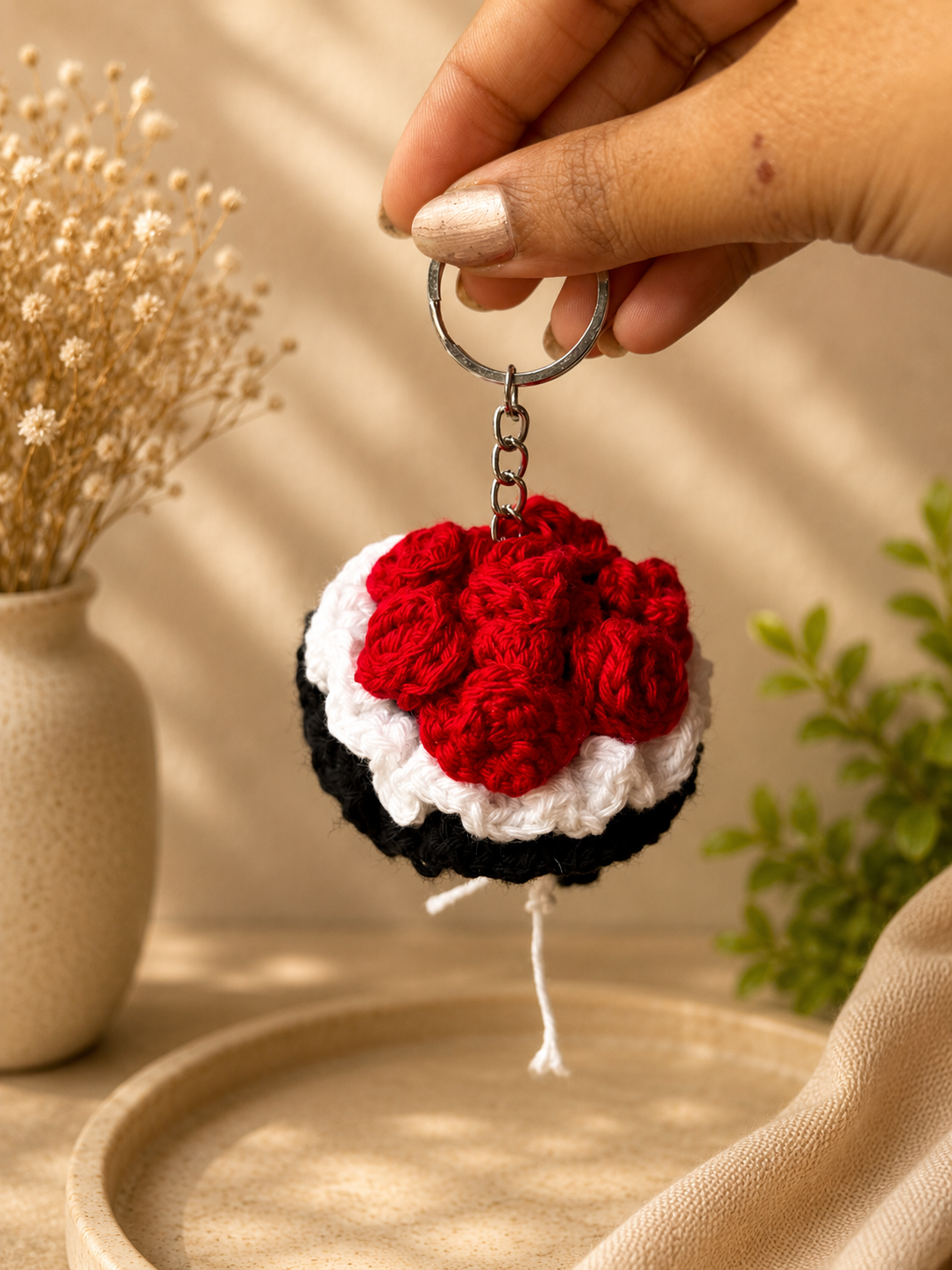 Red crochet bouquet keychain side view