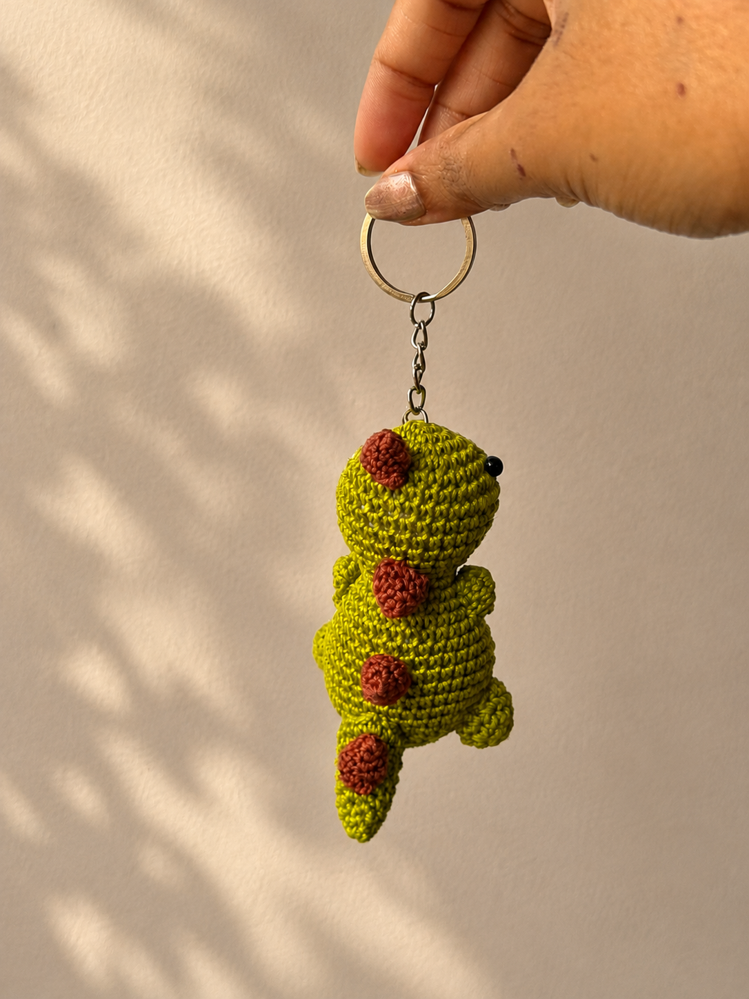Crochet dinosaur bag charm keychain