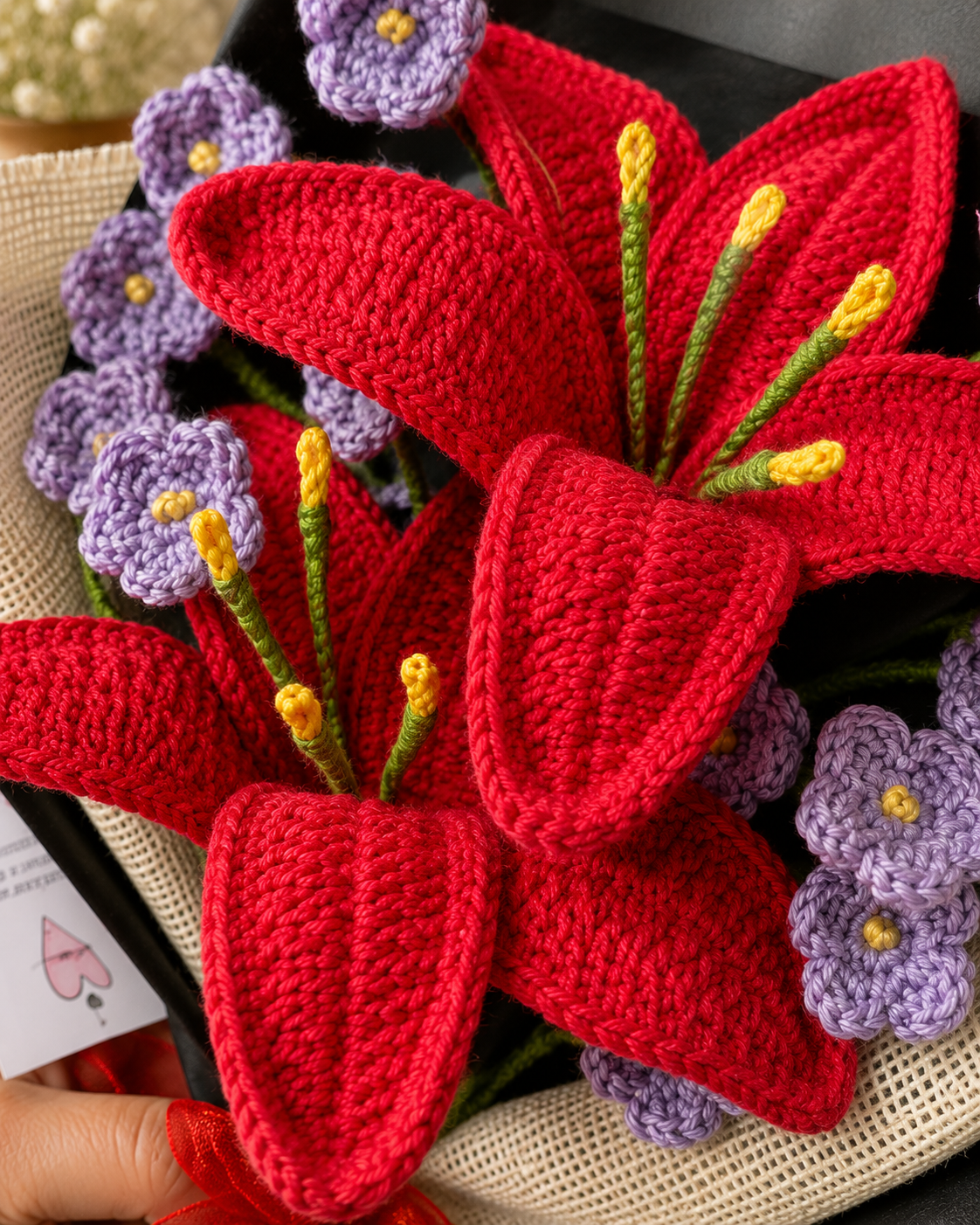 Close-up detail of handmade crochet red lily bouquet by Rubber Band