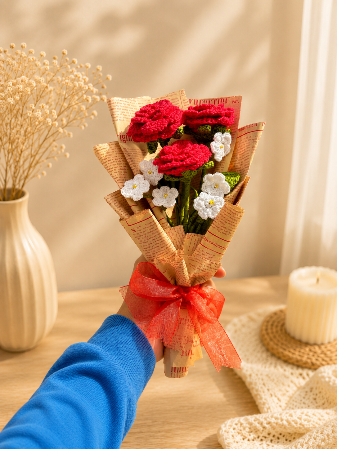 Handmade crochet red rose bouquet with white flowers wrapped with ribbon by Rubber Band