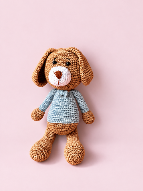 Biscuit the Puppy in a pale blue sweater, full front view