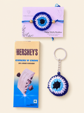 Blue crochet nazar rakhi gift set with matching keychain and chocolate