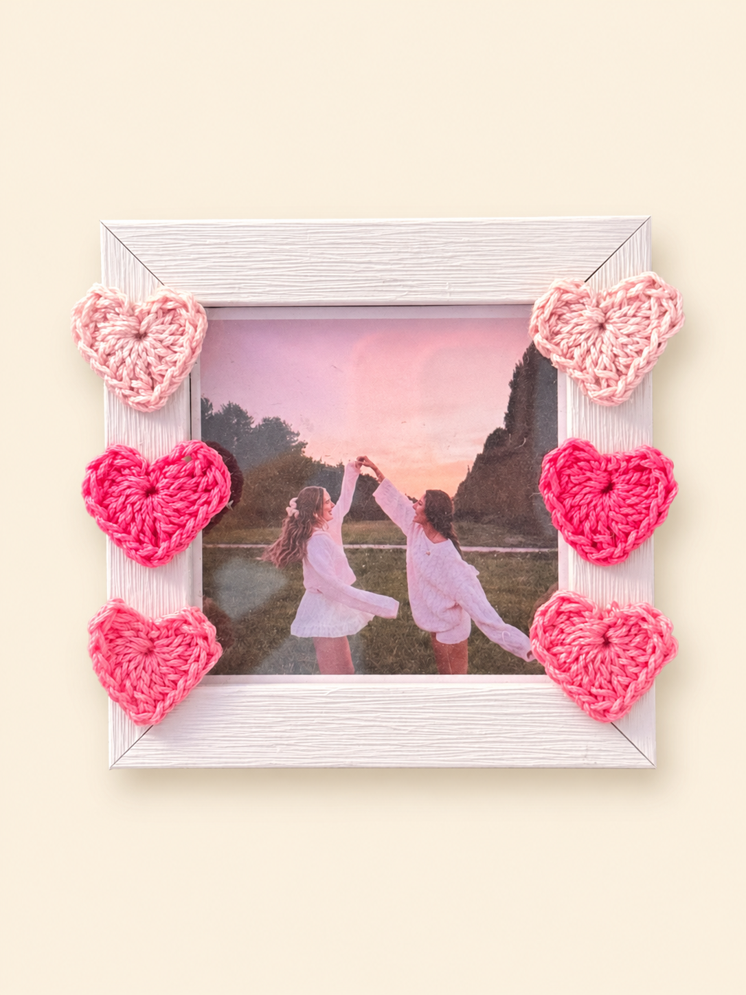 Photo frame decorated with handmade pink crochet hearts for the Rakhi gift set