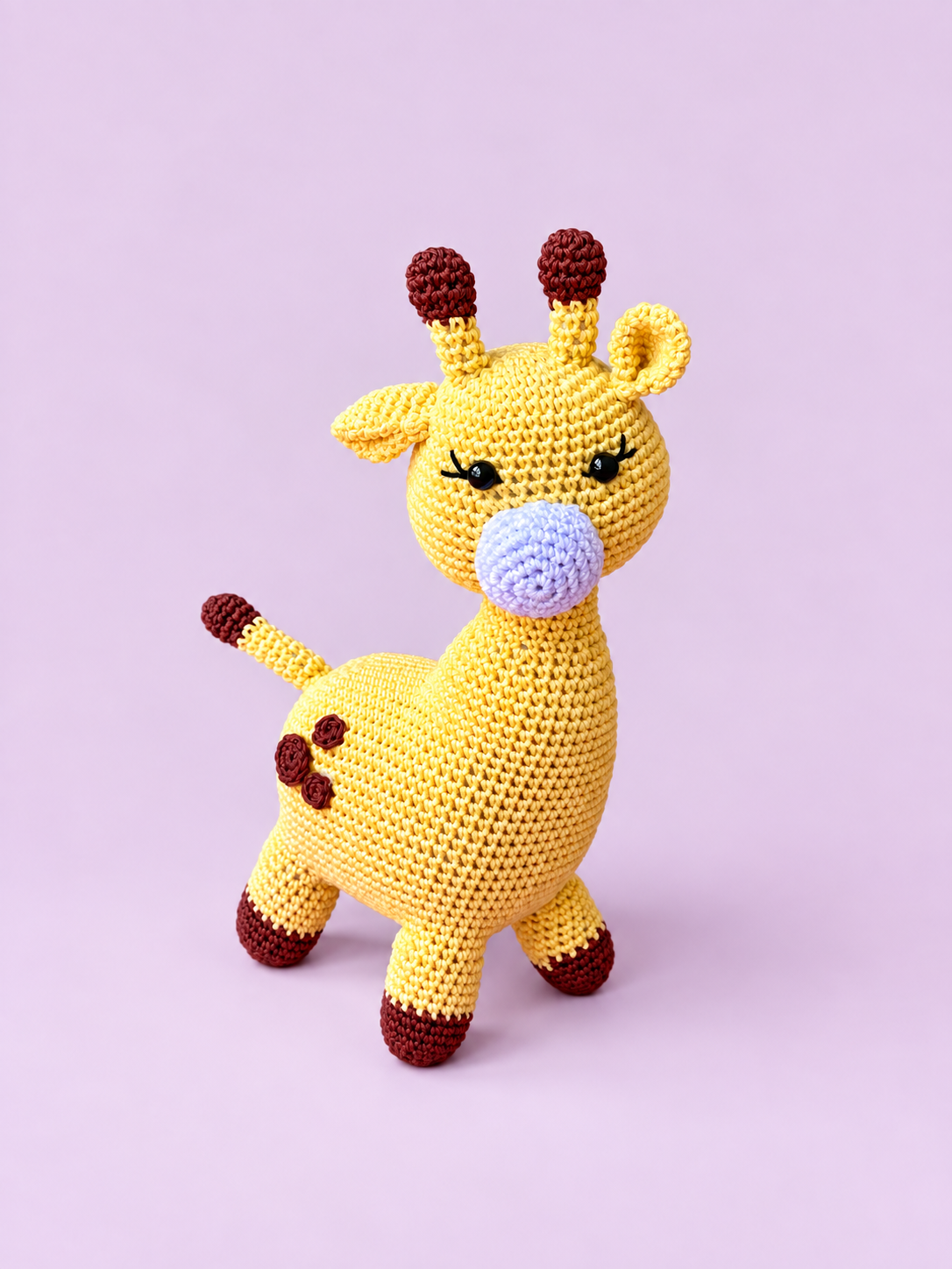 Dottie the Giraffe, full front view on a pastel lavender background