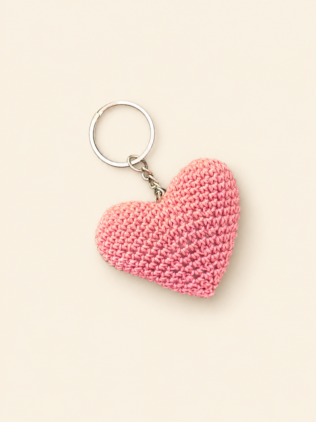 Handmade pink crochet heart keychain included in the Rakhi gift set