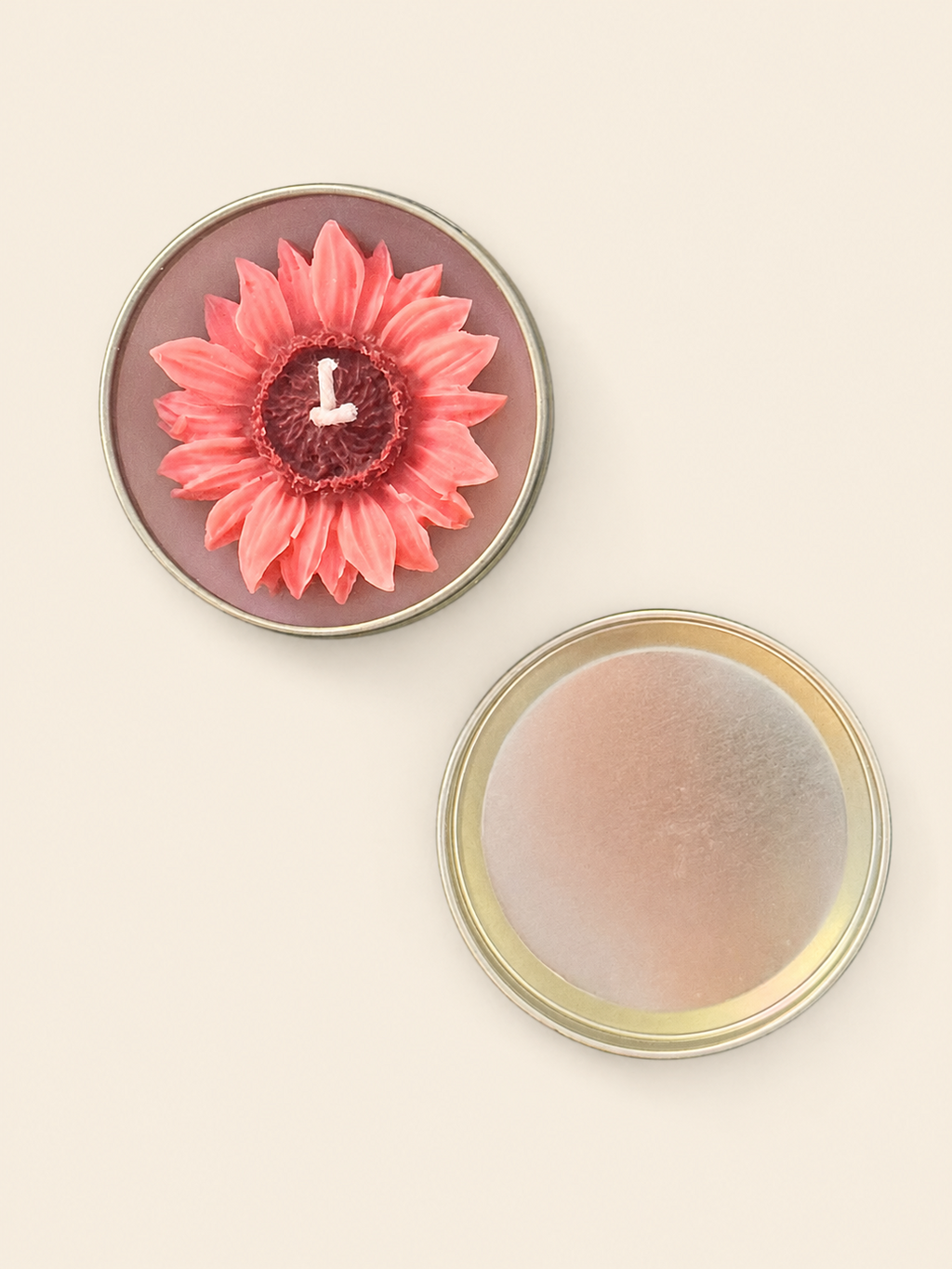 Pink flower-shaped candle in a reusable metal tin with lid