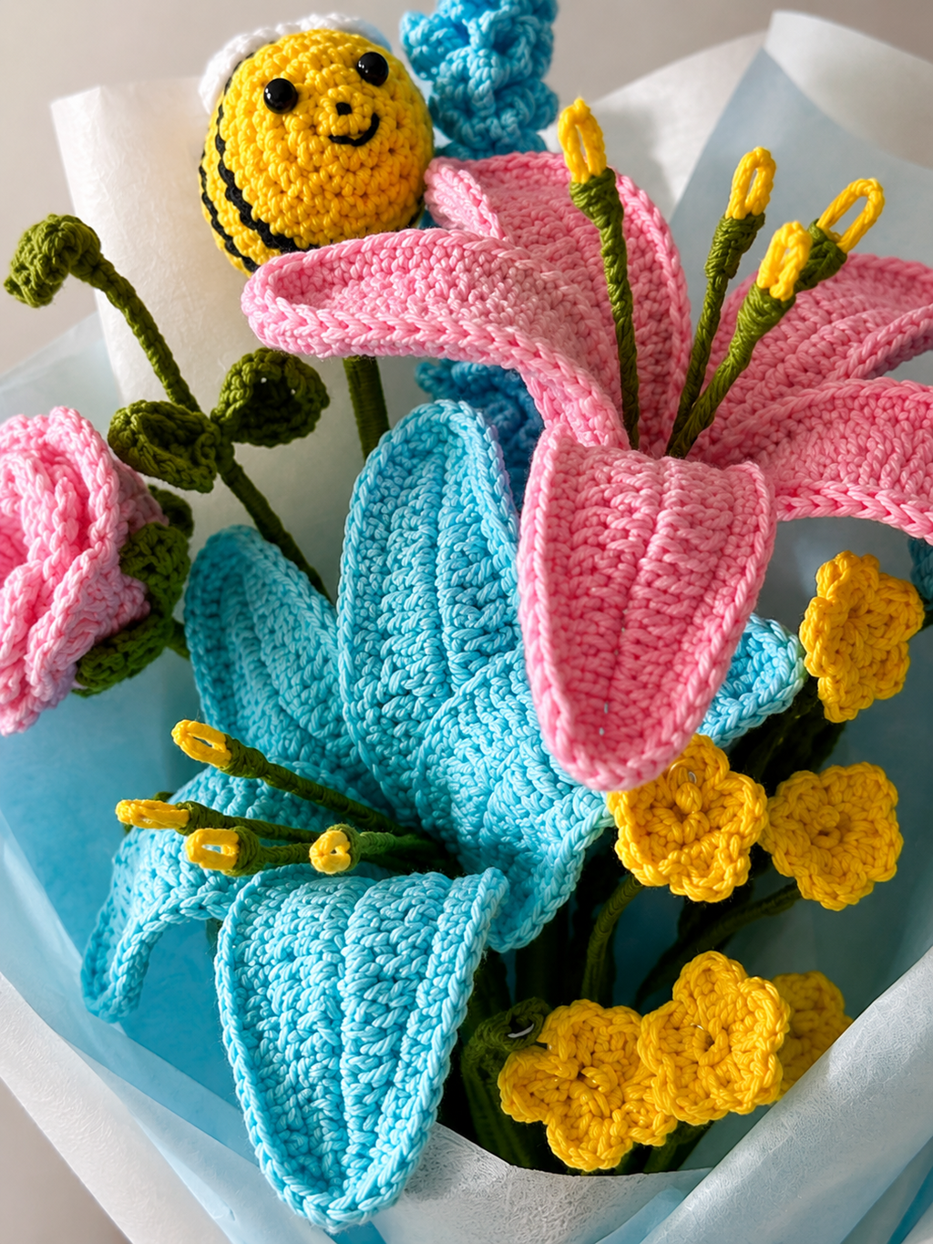 Close-up of handmade crochet blue lily bouquet by Rubber Band