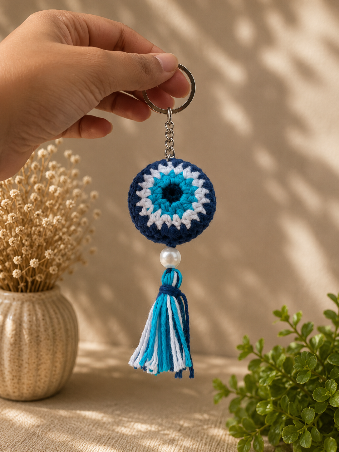 Close-up of handmade crochet tassel keychain by Rubber Band