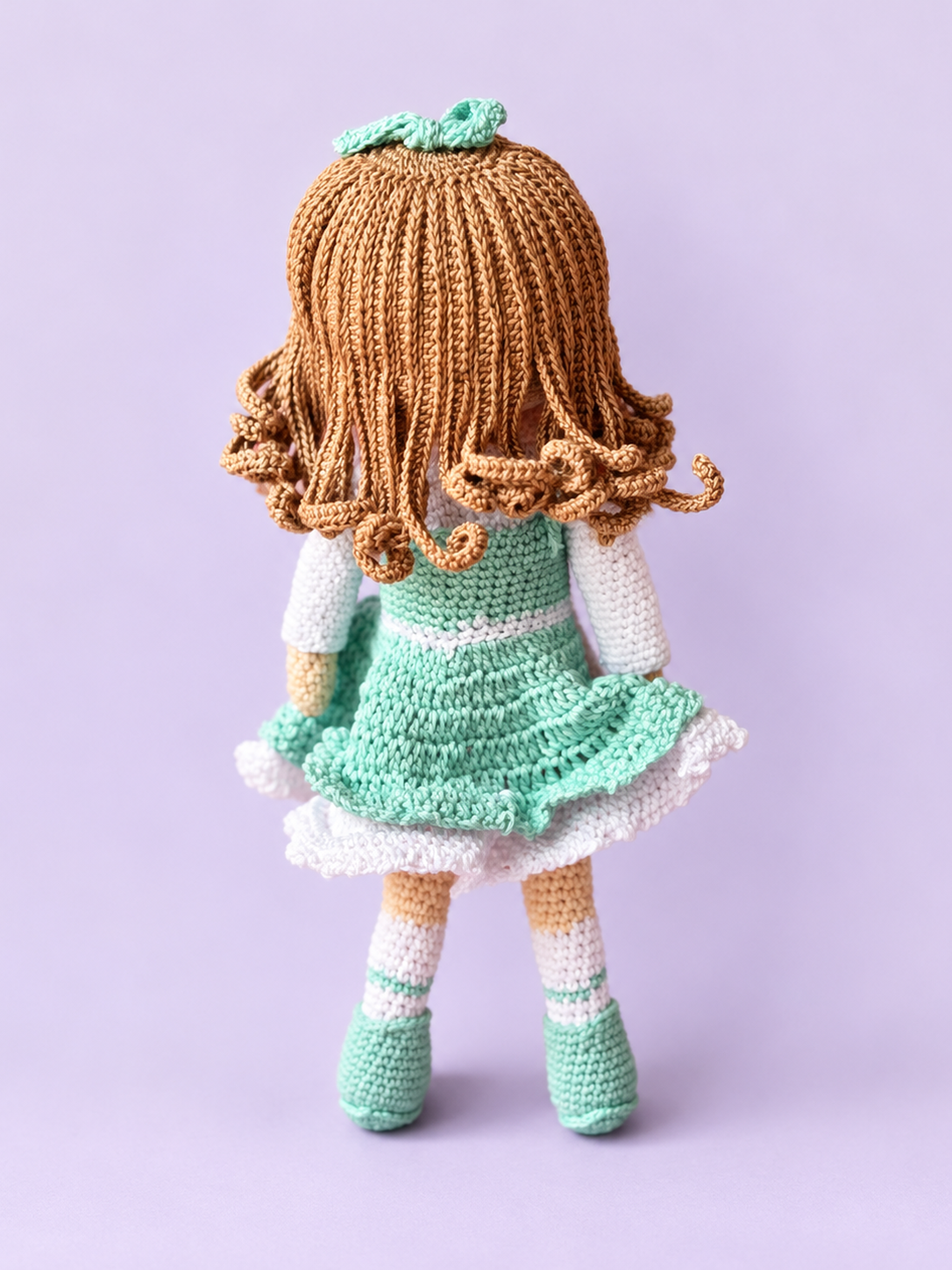 Rosie the Doll in mint dress, back view