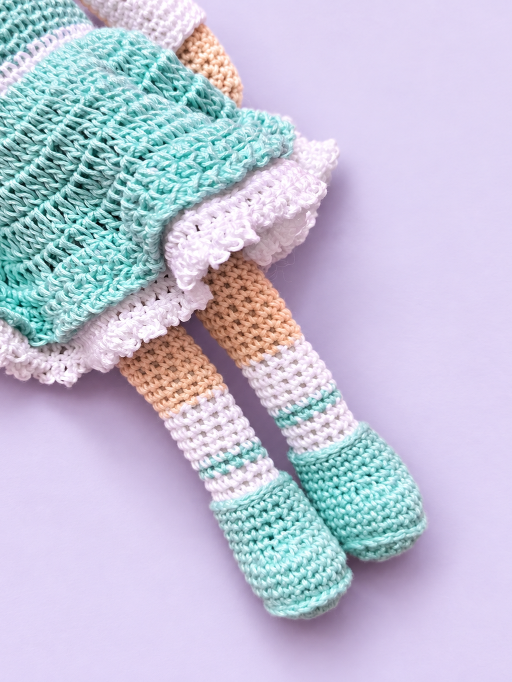 Close-up of Rosie's stockings and shoes in mint dress