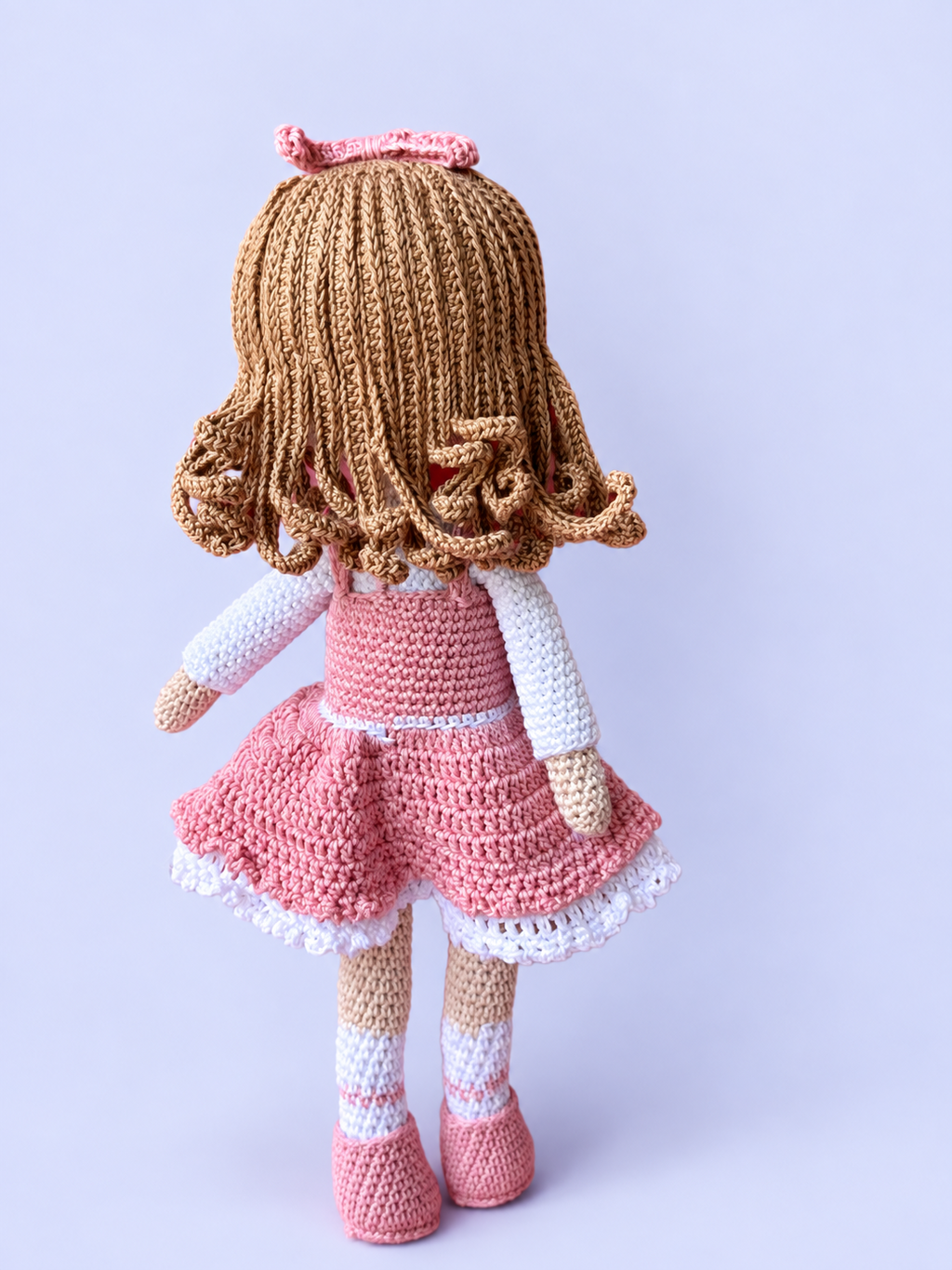 Rosie the Doll in pink dress, back view