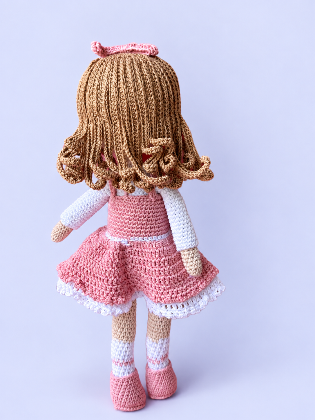 Rosie the Doll in pink dress, back view