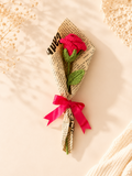Handmade crochet red rose bouquet wrapped with paper and red ribbon by Rubber Band