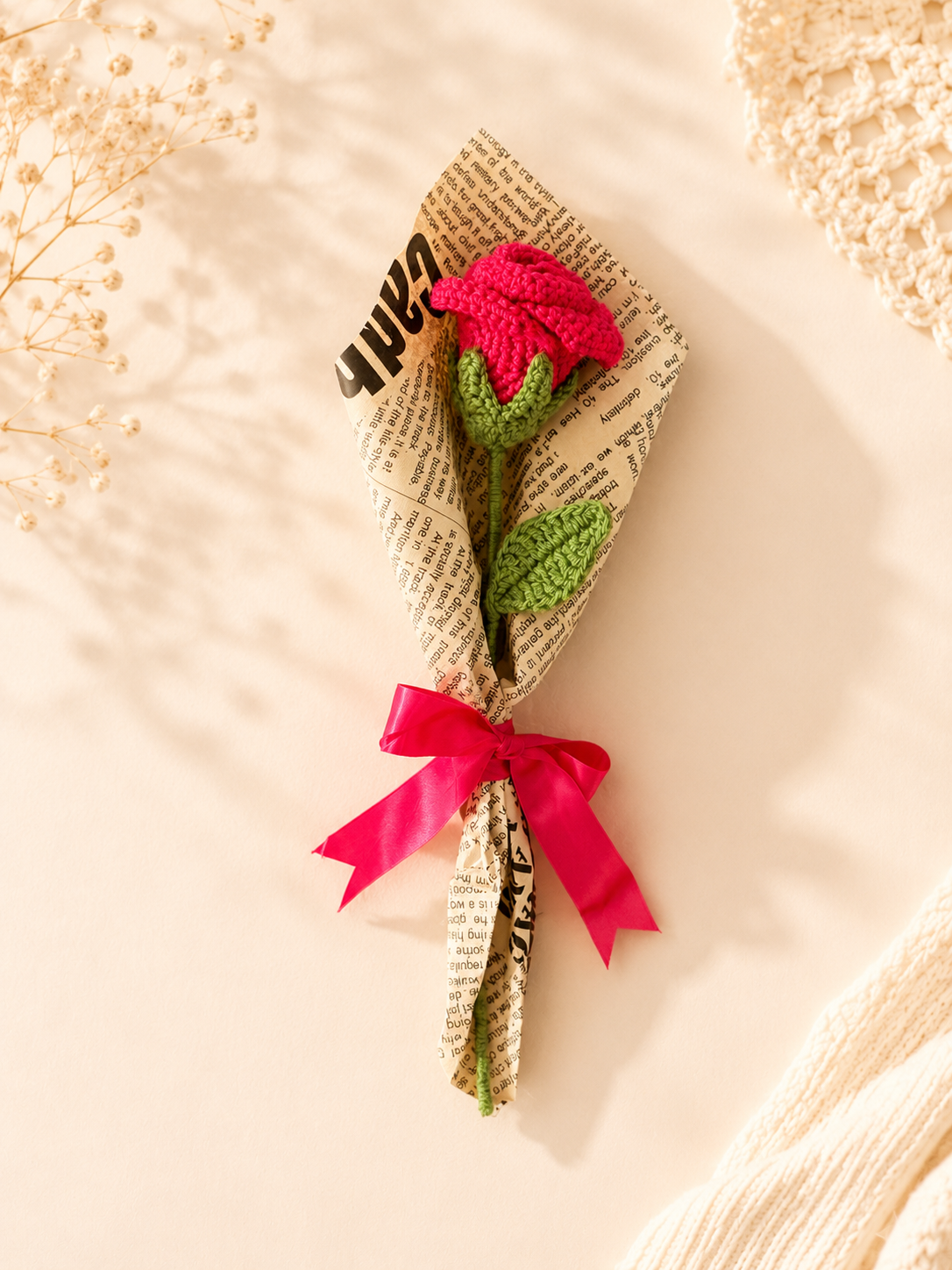 Handmade crochet red rose bouquet wrapped with paper and red ribbon by Rubber Band