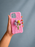 Handmade pink crochet phone cover with lavender and yellow flower bouquet