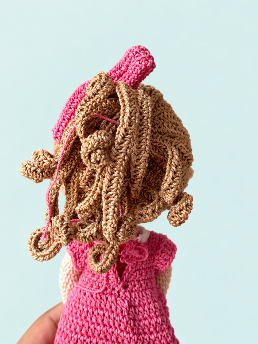 Sunny the Doll in pink dress, back view