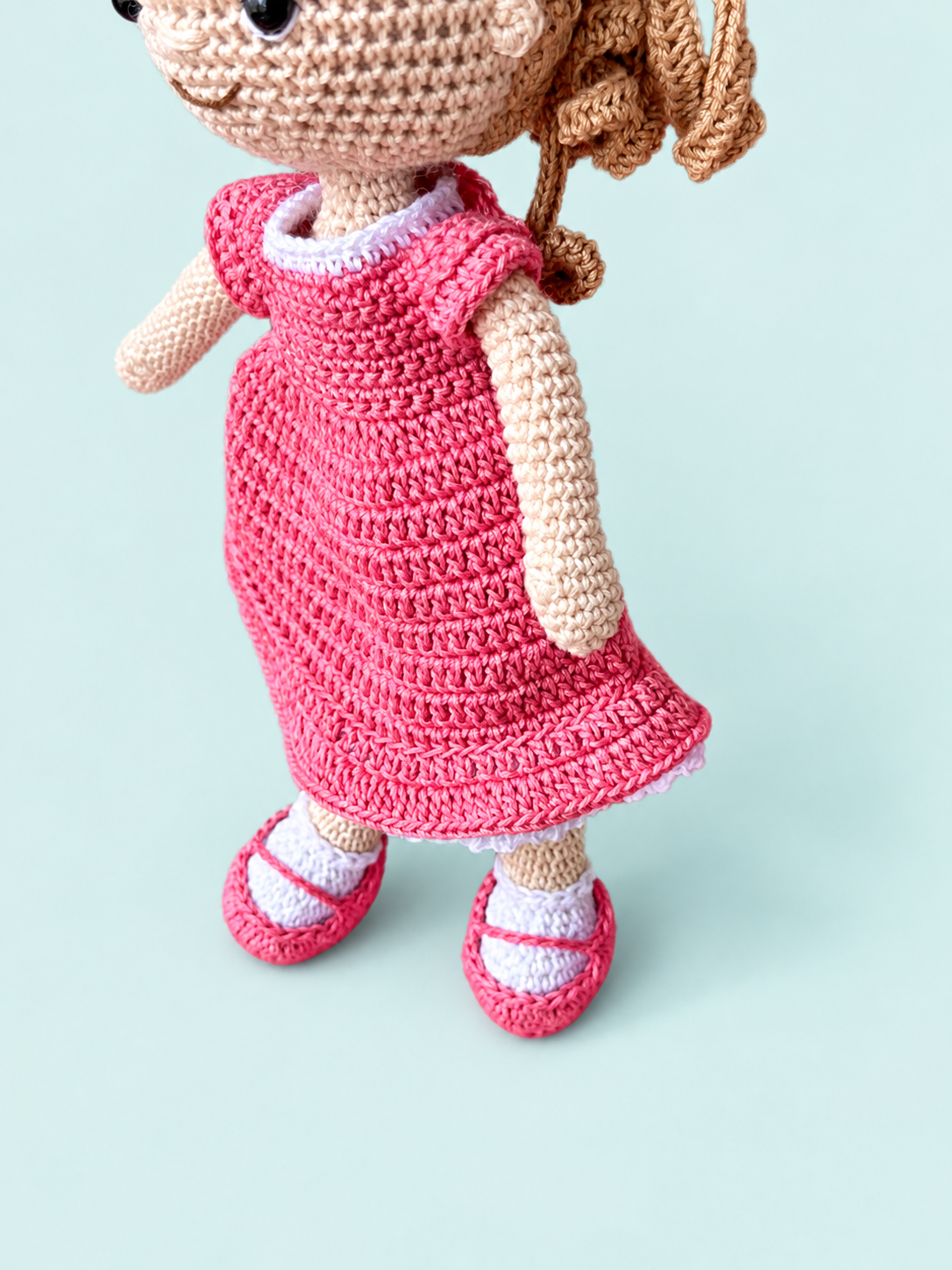 Detail of Sunny the Doll in pink dress