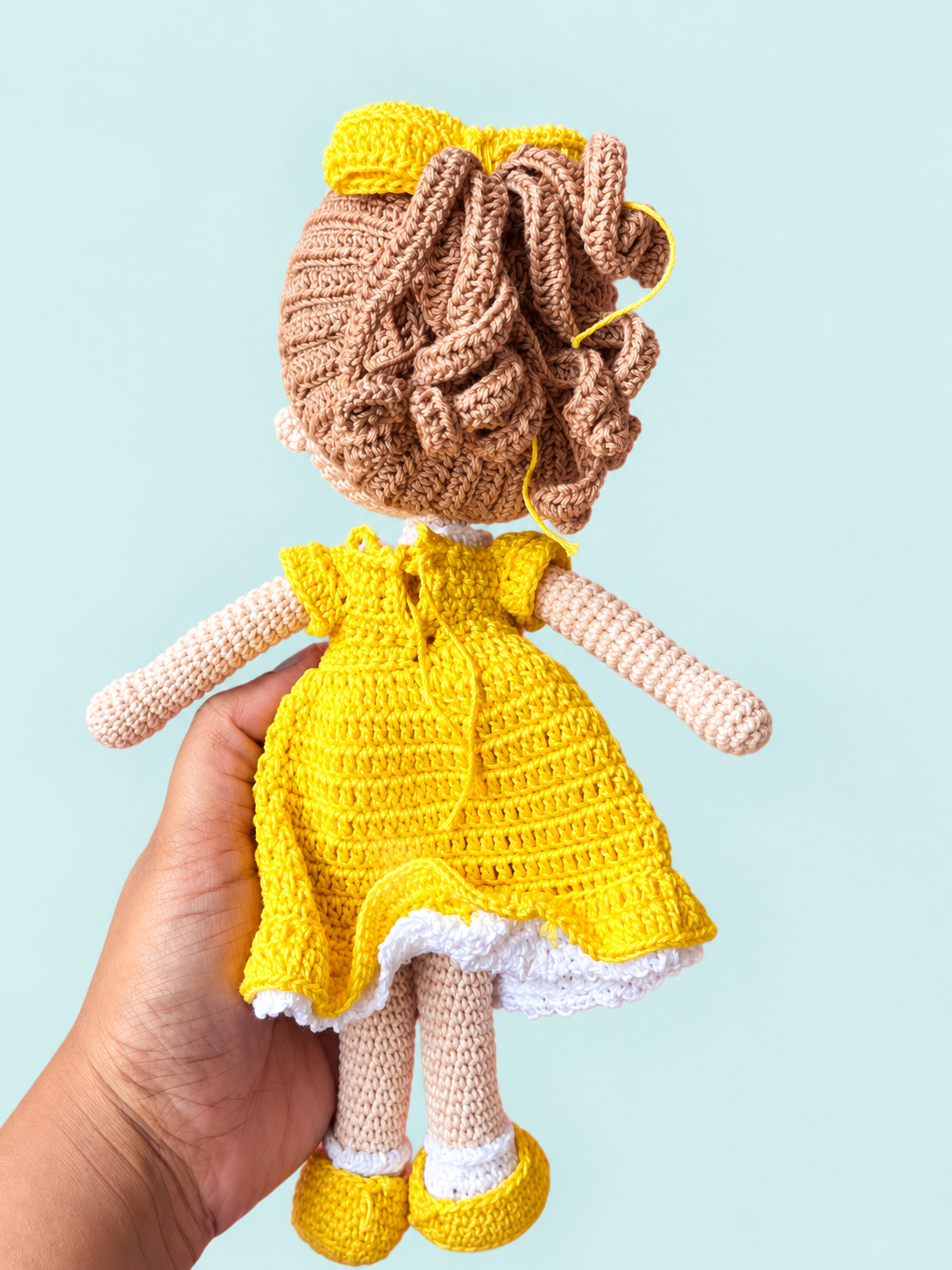 Sunny the Doll in yellow dress, back view