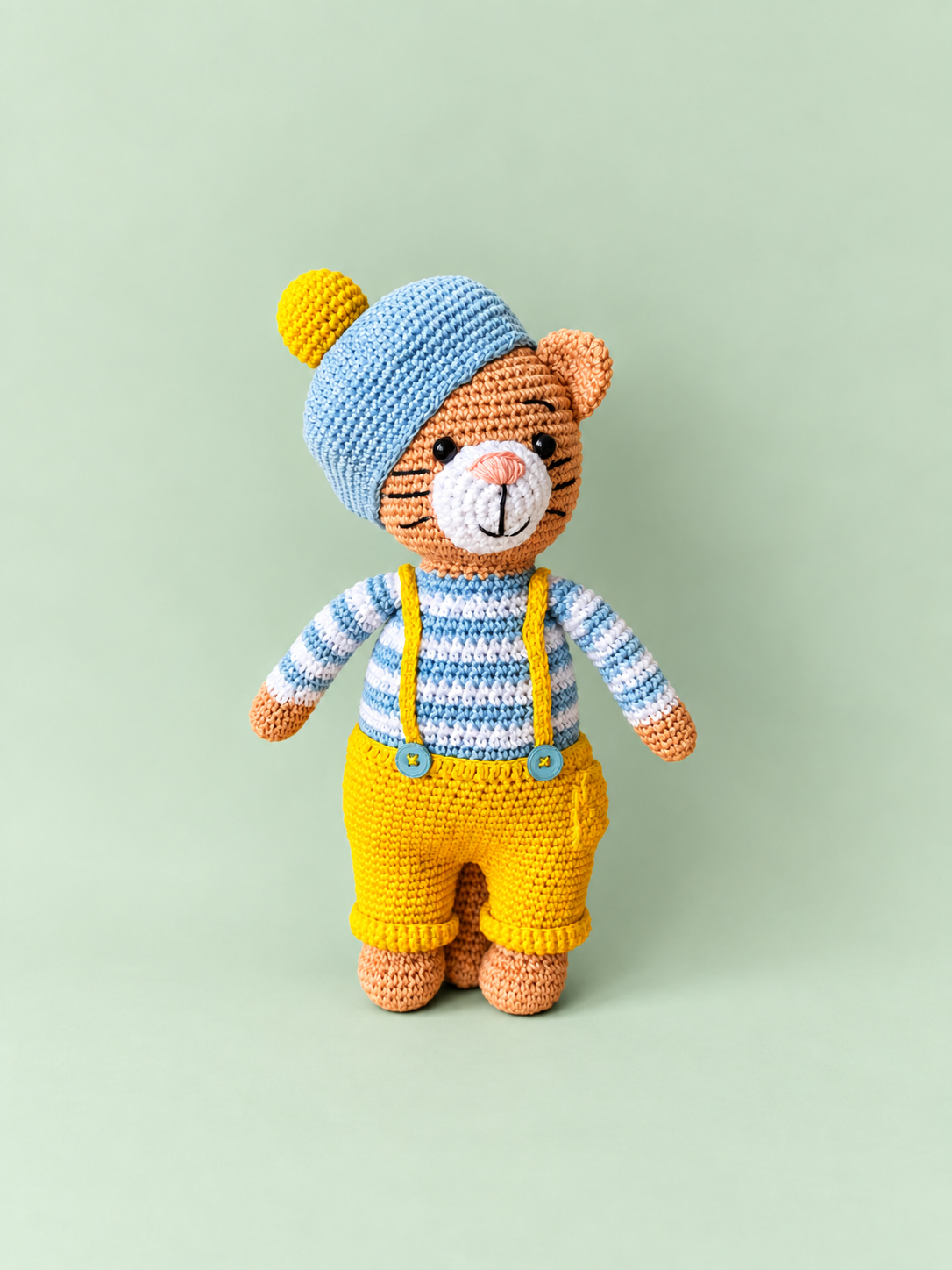 Tiggy the Cat full front view, blue hat and yellow overalls